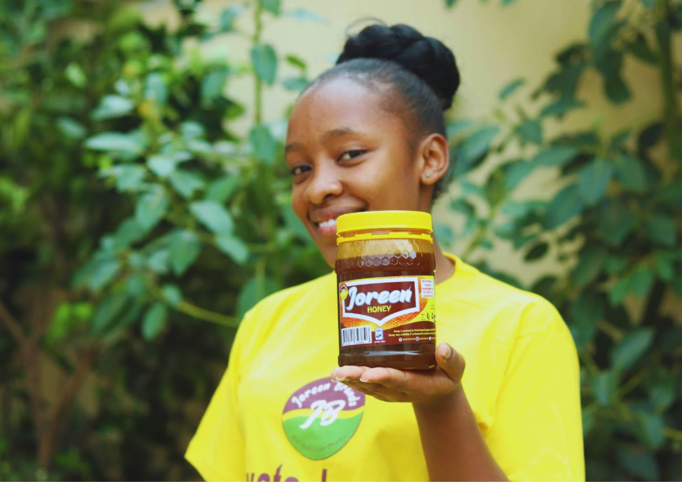 Joreen holding a jar of honey from Joreen Brands.